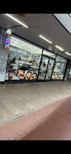Gevel Barbershop Talix in Den Haag met verlichte barberpole